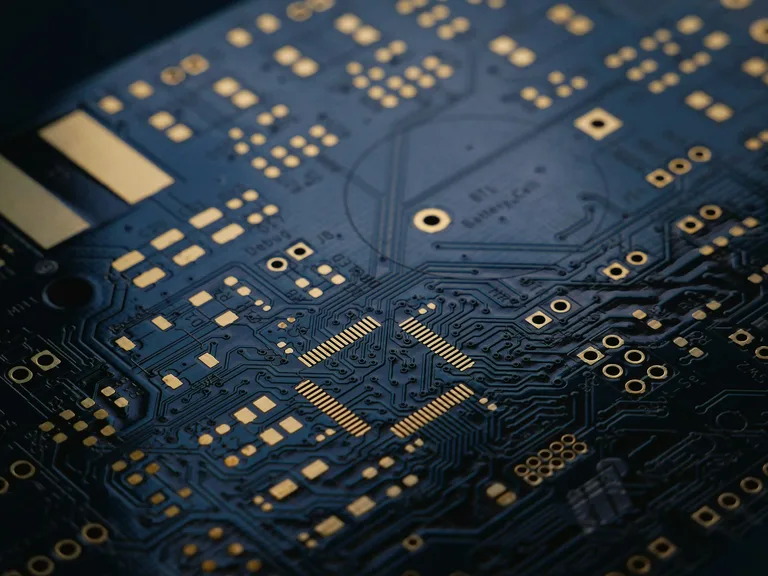 Electronics and telecommunications equipment on a workbench — wholesale supply enquiry context